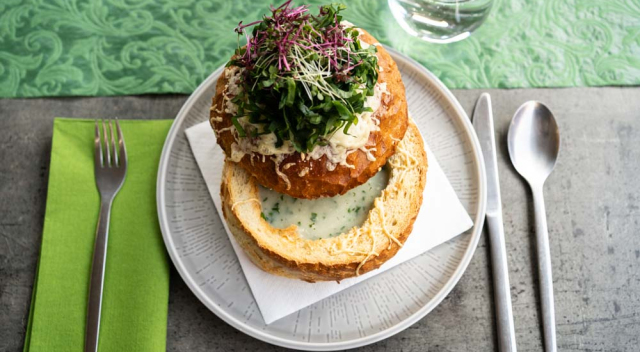 Wild garlic cream soup served in a bread bowl