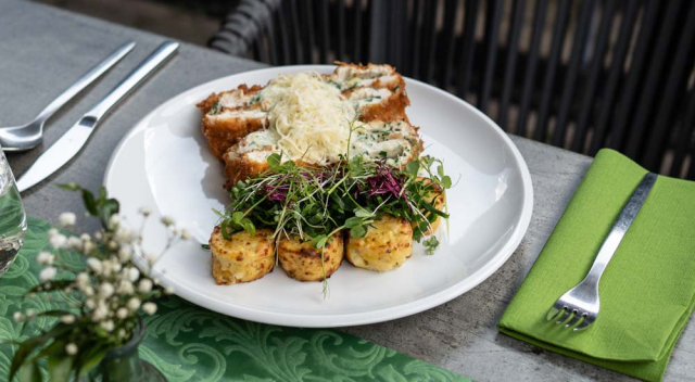 Chicken breast stuffed with wild garlic cream cheese in panko crust, Jerusalem  artichoke gratin